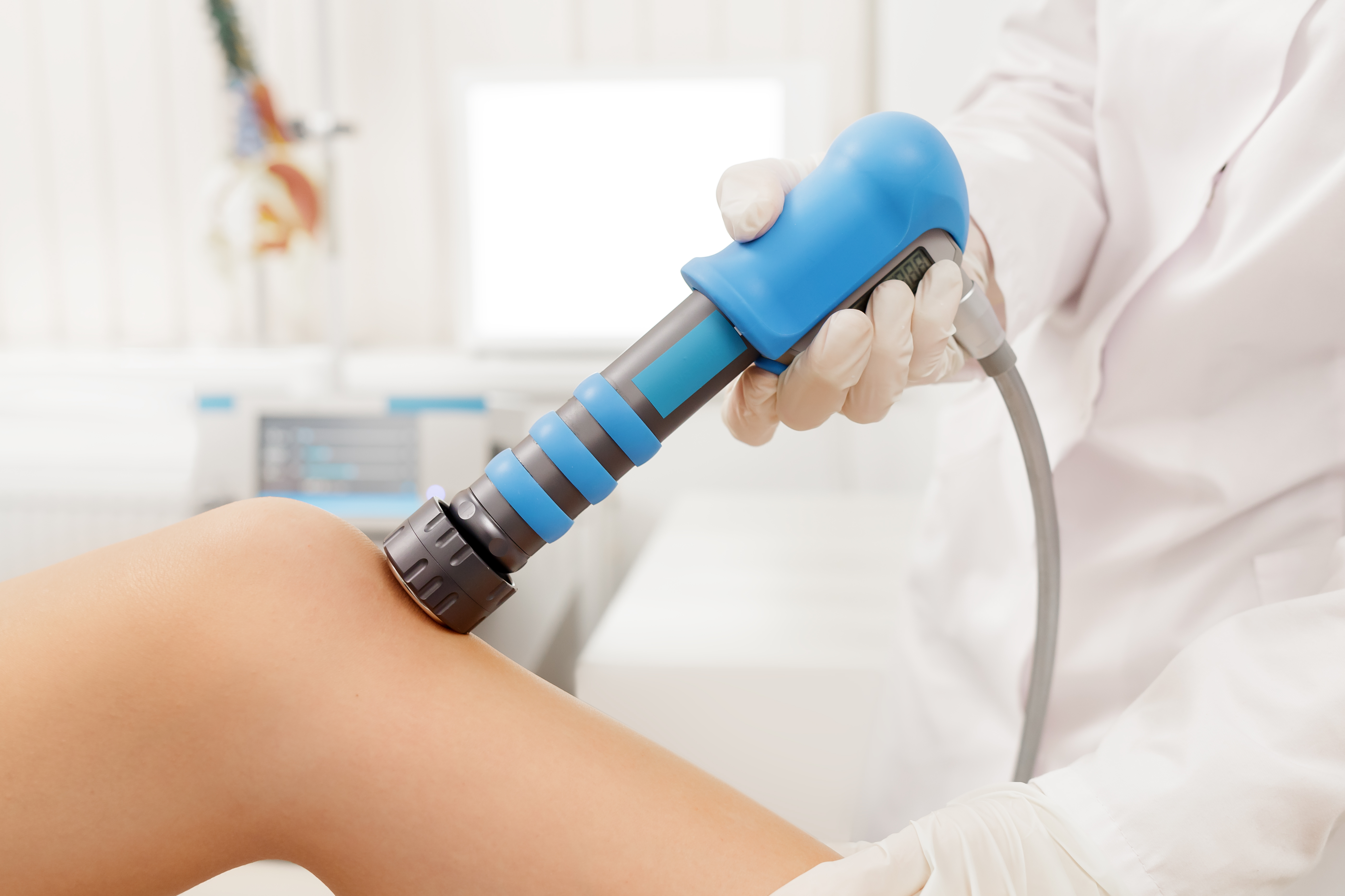 Extracorporeal Shockwave Therapy ESWT. Effective non-surgical treatment for pain. Physical therapy of knee with shock waves.Pain relief, normalization and regeneration, stimulation of healing process Extracorporeal Shockwave Therapy ESWT. Effective non-surgical treatment for pain. Physical therapy of knee with shock waves. Pain relief, normalization and regeneration, stimulation of healing process