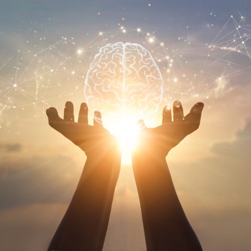 Abstract palm hands holding brain with network connections, innovative technology in science and communication concept